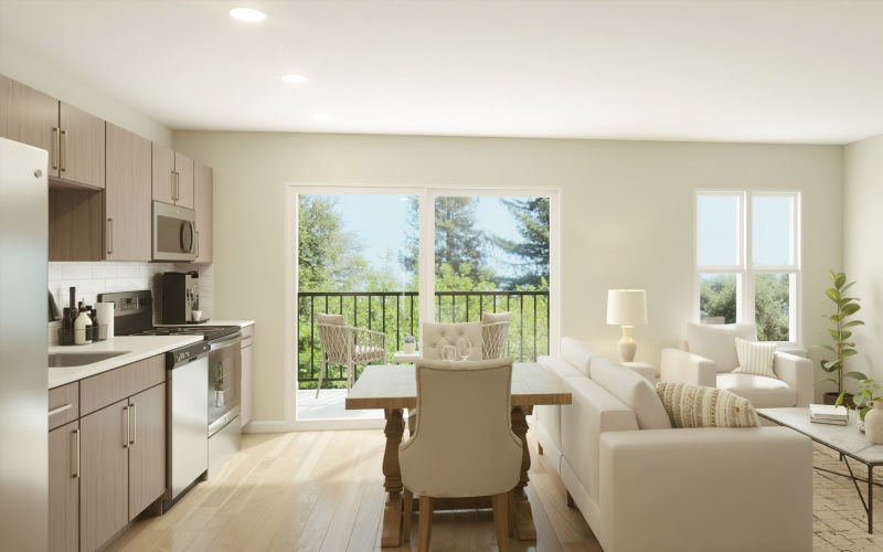 a living room with chairs and a table